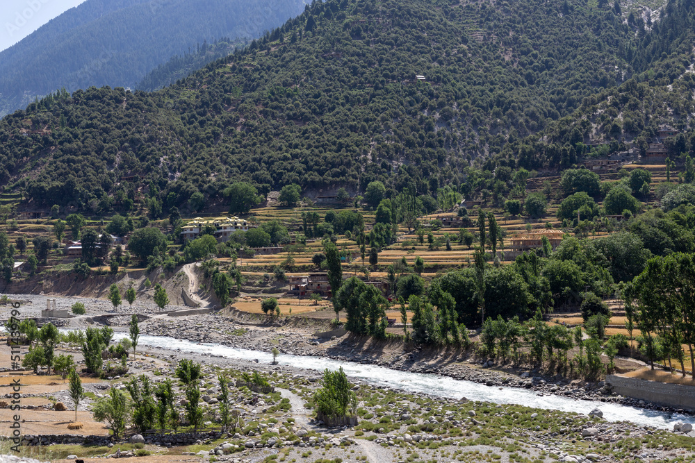 Beautiful landscape view of upper dir river and wheat fields