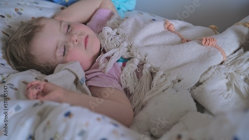 Adorable Cute Caucasian Baby Toddler Girl Sleeping Peacefully Under Blanket During Midday Nap