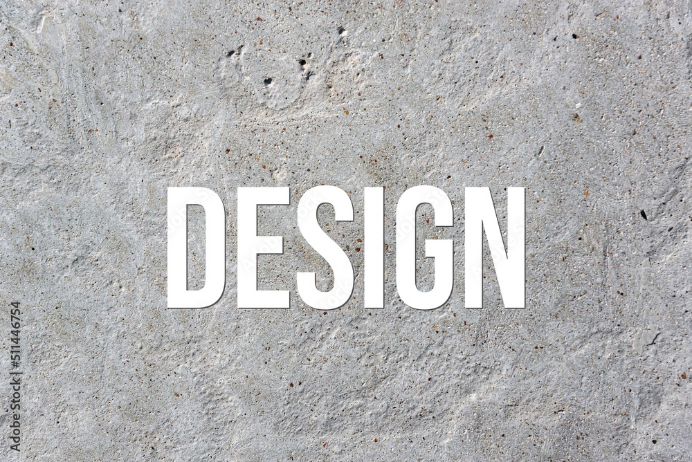 DESIGN - word on concrete background. Cement floor, wall. DESIGN - word on concrete background. Cement floor, wall.