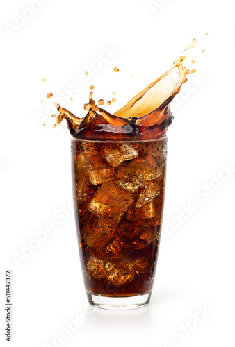 Glass of cool cola with splash isolated on white background.