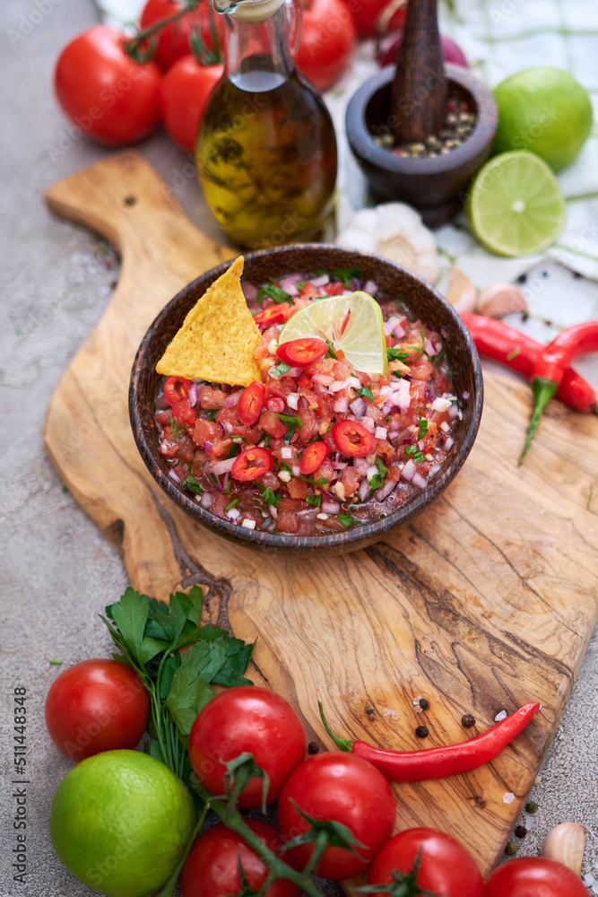freshly made salsa dip sauce with nacho chips on wooden board freshly made salsa dip sauce with nacho chips on wooden board