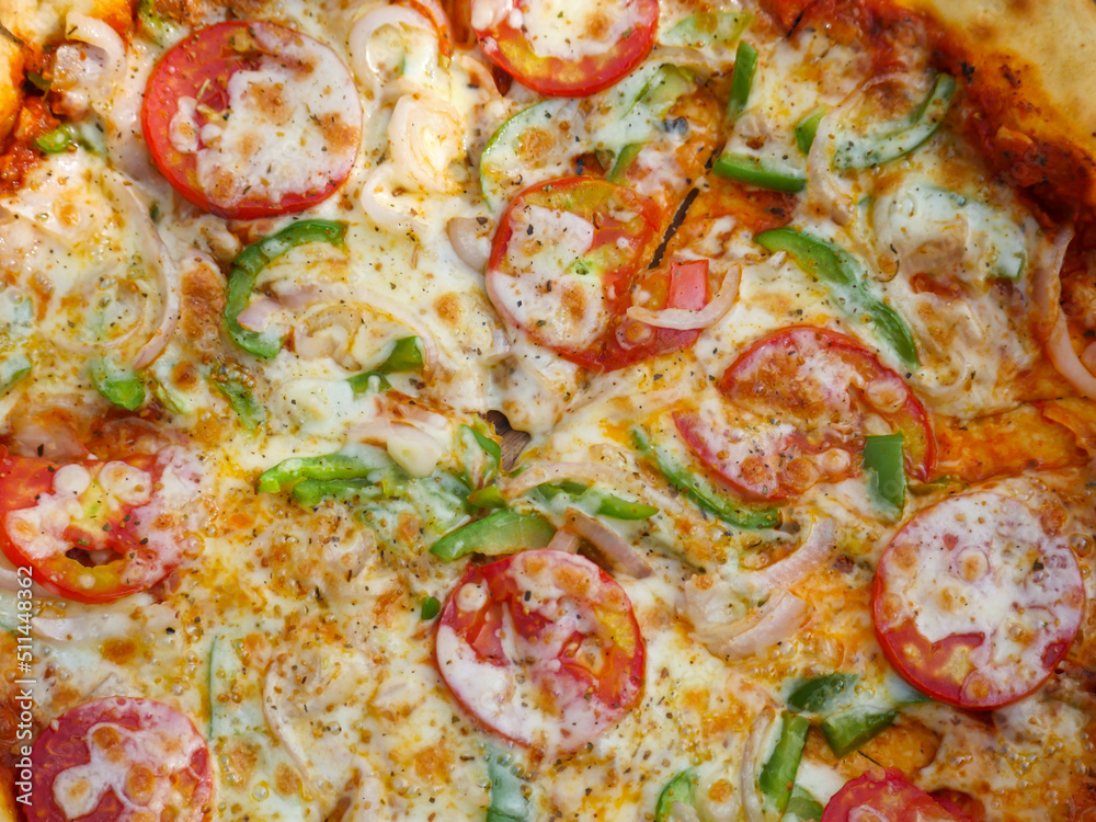 Vegetarian cheese Pizza in india topped with tomatoes, capsicum and onion. Indian veg pizza Vegetarian cheese Pizza in india topped with tomatoes, capsicum and onion. Indian veg pizza