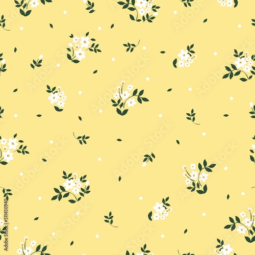Simple vintage pattern. small white flowers , green leaves . Light yellow background. Fashionable print for textiles and wallpaper.