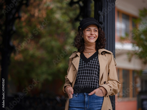 Young beautiful woman in autumn street