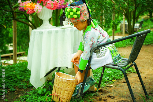 Asian Hmong girl having a relaxing holiday in an orange orchard
