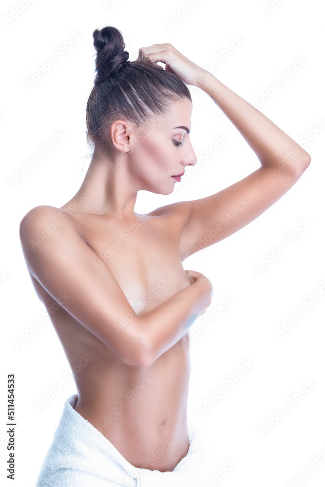 Obraz premium Tranquil Nude and Naked Winsome Caucasian Female With Tanned Curved Slim Body Standing With Crossed Hands While Posing Wrapped in Bath Towel