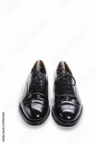 Footwear Concept. Pair of Stylish Classic Formal Male Stylish Black Polished Oxford Leather Laced Shoes Placed Together Over White. © danmorgan12