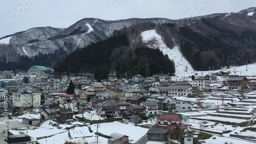 Japanese apartment buildings in nozawa onsen ski town in nagano japan during winter photo