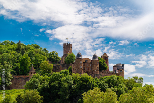 Burg Wertheim Landscape Photo with Cloudy Sky. medieval Castle in Germany Next to Majna River in a beautiful valley. German name is Burg Werheim. Amazing view in clear daylight