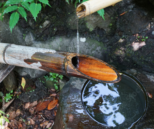 Obraz na plátně A quaint decoration called Shishiodoshi, made of bamboo tubes with water flowing