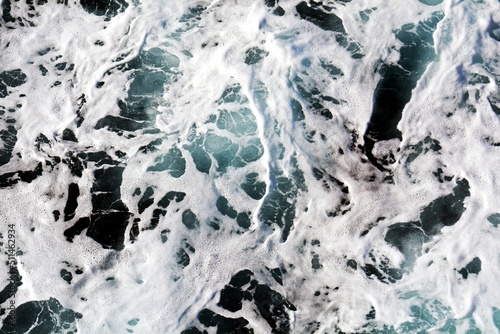 Foam, sea waves, water drops on the glass