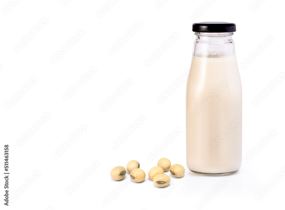 bottle of soy milk with soybean on white