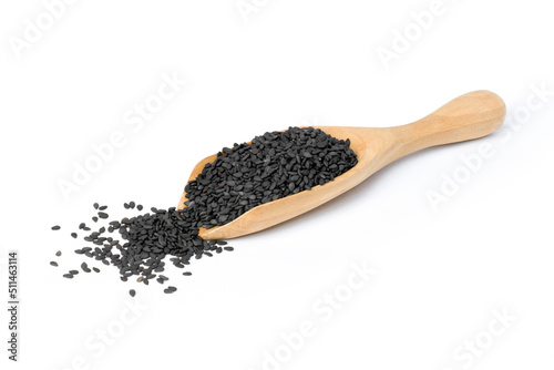 Black sesame seeds in wooden scoop isolated on white background.