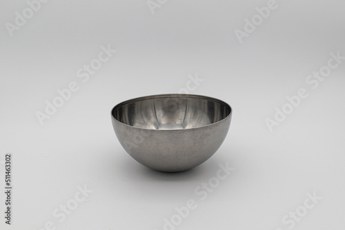 metal salad bowl on white background.