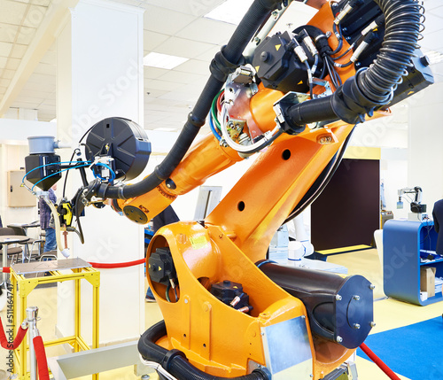 Welding robotic arm industry and metal part photo