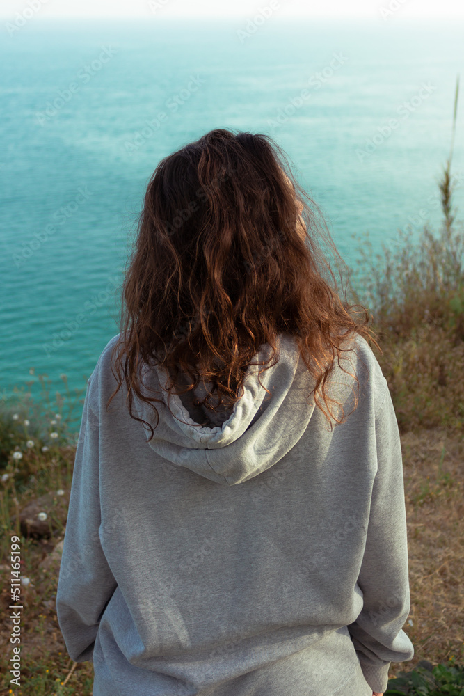 woman looking at the sea woman looking at the sea