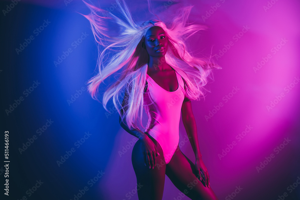 Photo of alluring appealing girl relaxing at disco club surrounded by fluorescent illumination background