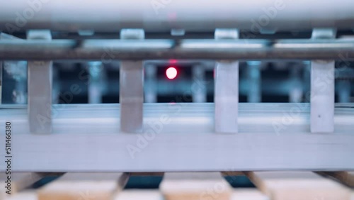 Close up, Automatic line for printing and cutting in the printing house.