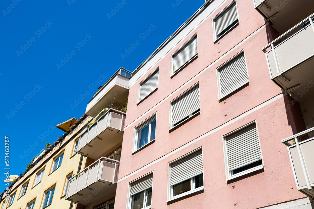 Rows of houses, apartment buildings, condominiums in Schwabing, blue sky