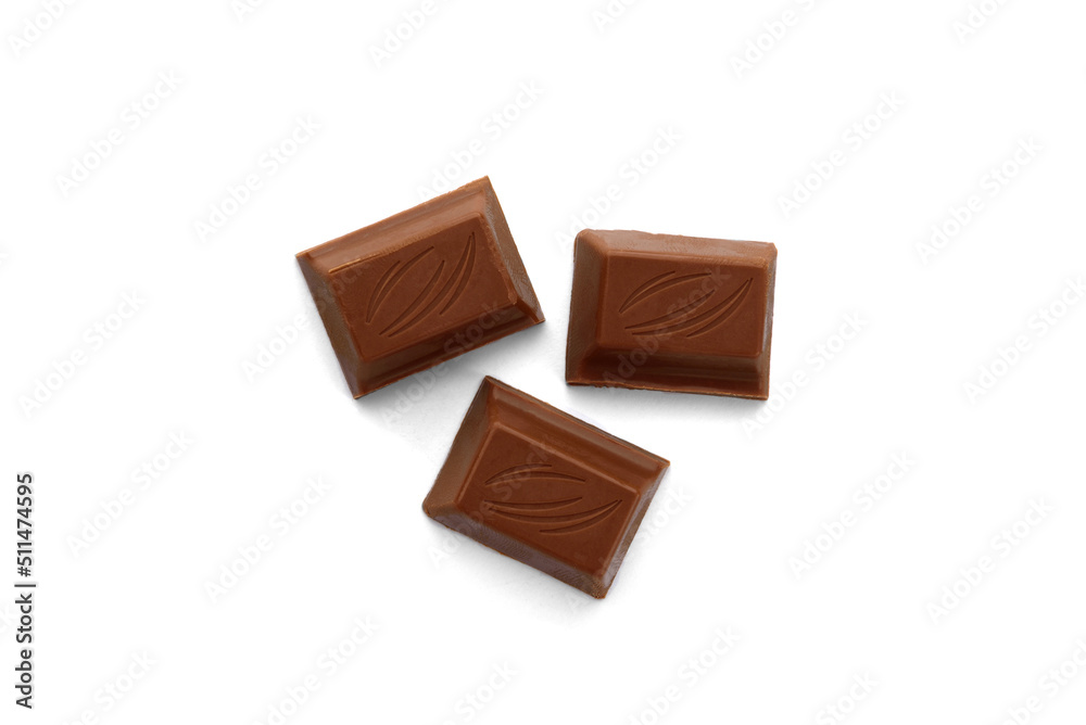 Fototapeta premium Chocolate pieces with milk filling isolated on white background.