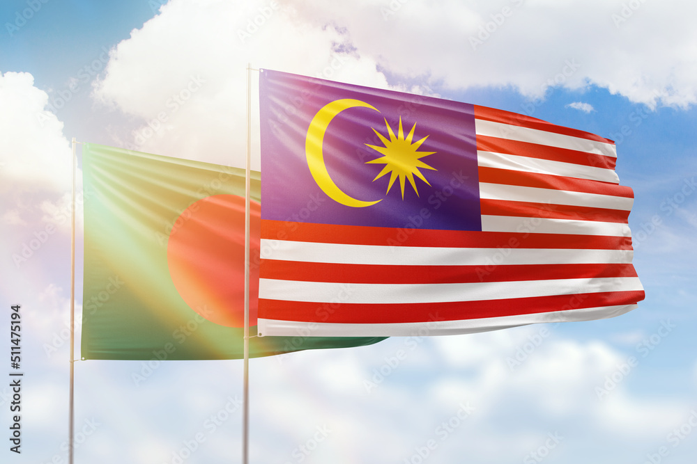 Sunny blue sky and flags of malaysia and bangladesh Sunny blue sky and flags of malaysia and bangladesh