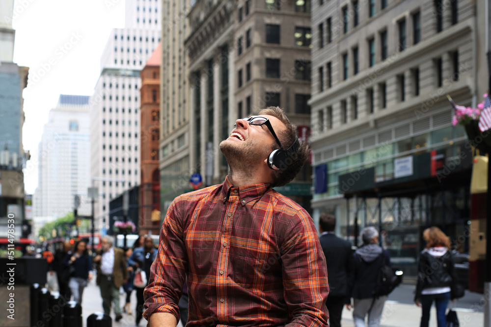Handsome man listens music with joy and happiness in New York