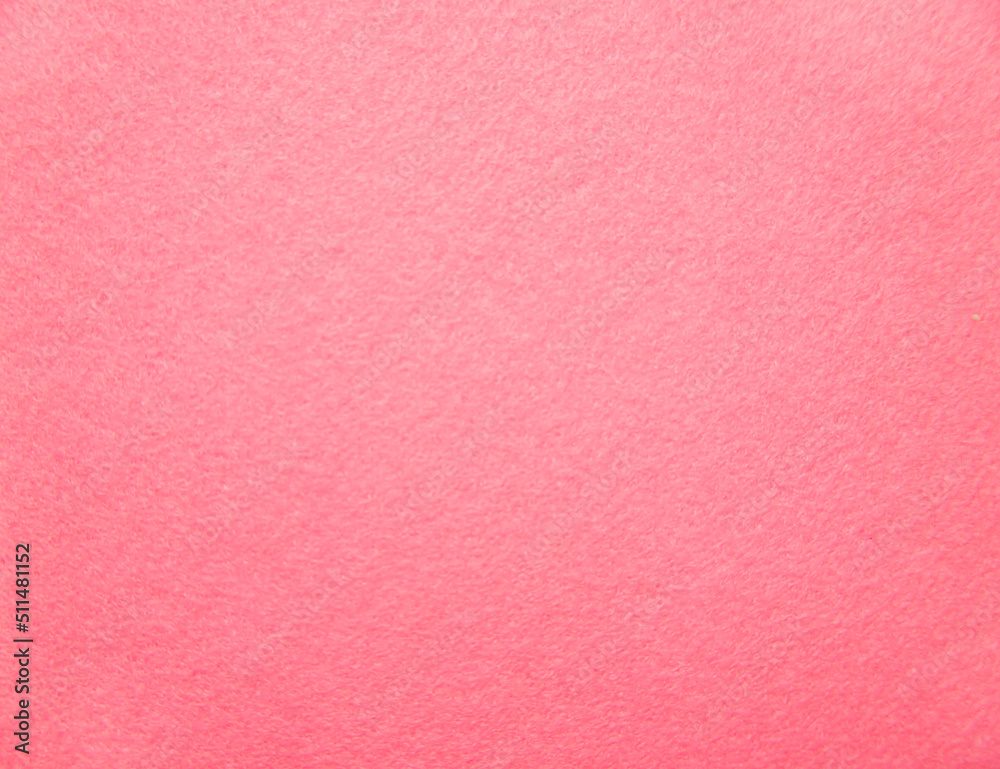 Fototapeta premium Pink felt fabric close-up. Abstract background. The texture of the fibers. Velvet surface.