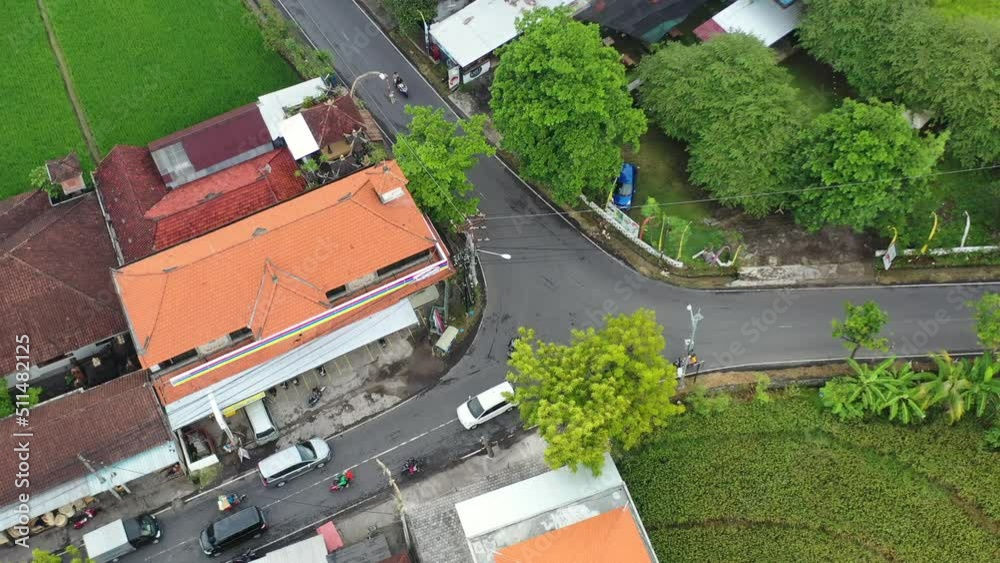 aerial top down of traffic approaching a fork in the road in bali indonesia aerial top down of traffic approaching a fork in the road in bali indonesia