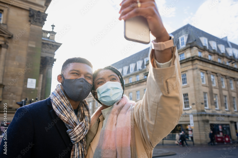 Couple Wearing Face Masks Taking Selfie