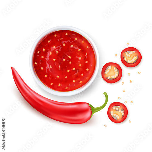 Red sweet chili sauce or salsa in a white saucer. Red hot chilli pepper cut into pieces.