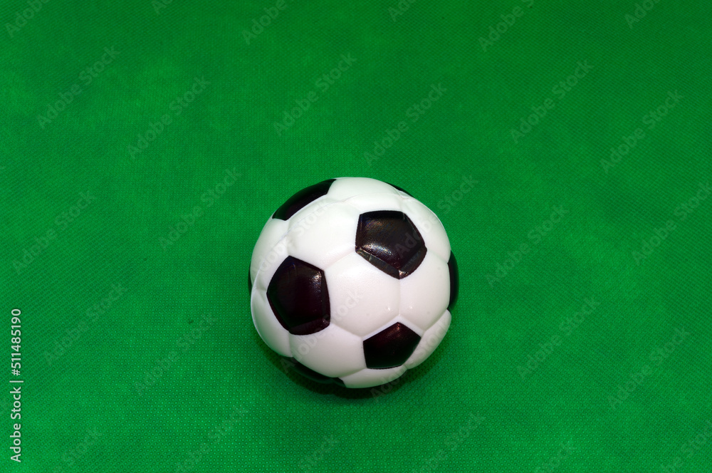 Football isolated in front of green background Football isolated in front of green background
