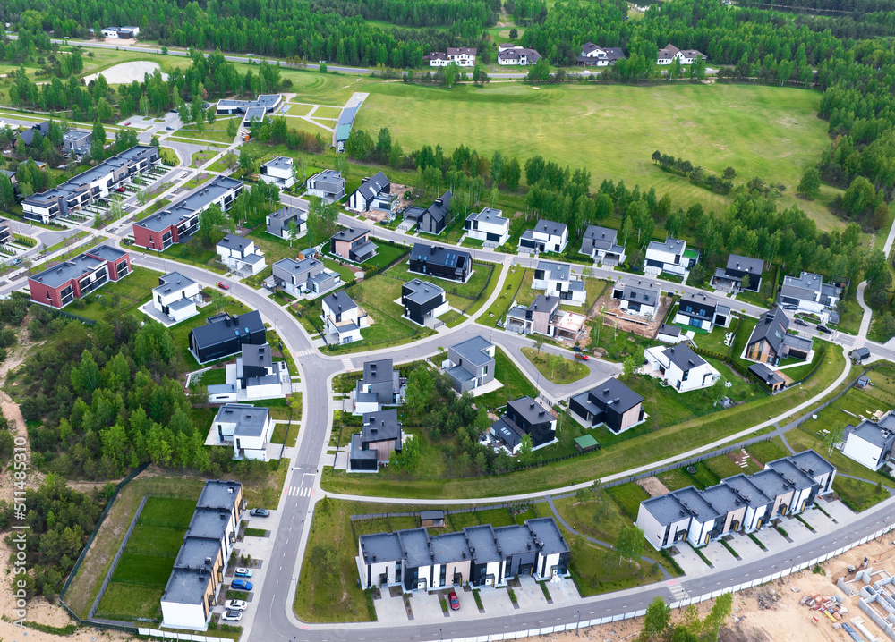 Townhouses and suburd two-floor home, aerial view. Suburb houses and modern residential buildings. Cottage, townhouse and line house. Roofs of suburban private houses in forest area. . Townhouses and suburd two-floor home, aerial view. Suburb houses and modern residential buildings. Cottage, townhouse and line house. Roofs of suburban private houses in forest area. .