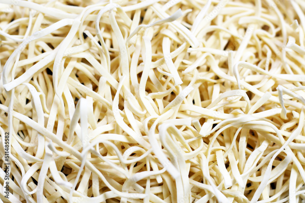 Homemade noodles for soup, background, top view Homemade noodles for soup, background, top view