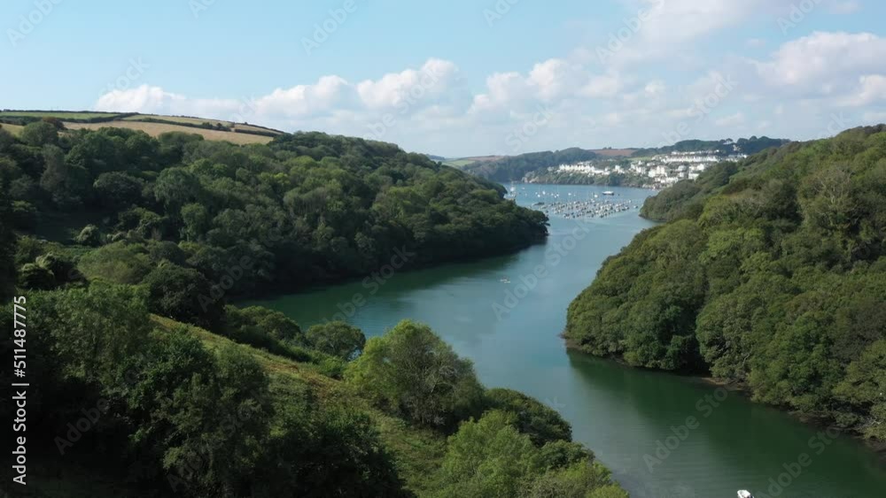 Low aerial view flying along the River Fowey, in Cornwalls Area of Outstanding Natural Beauty towards Fowey town. Low aerial view flying along the River Fowey, in Cornwalls Area of Outstanding Natural Beauty towards Fowey town.