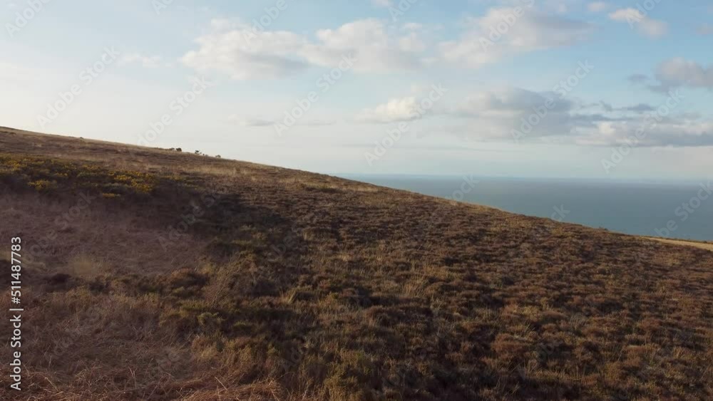 Aerial Tracking Shot at Sunset Over Moorland with Lovely Blue Sky and Beautiful Sea in North Devon UK Aerial Tracking Shot at Sunset Over Moorland with Lovely Blue Sky and Beautiful Sea in North Devon UK