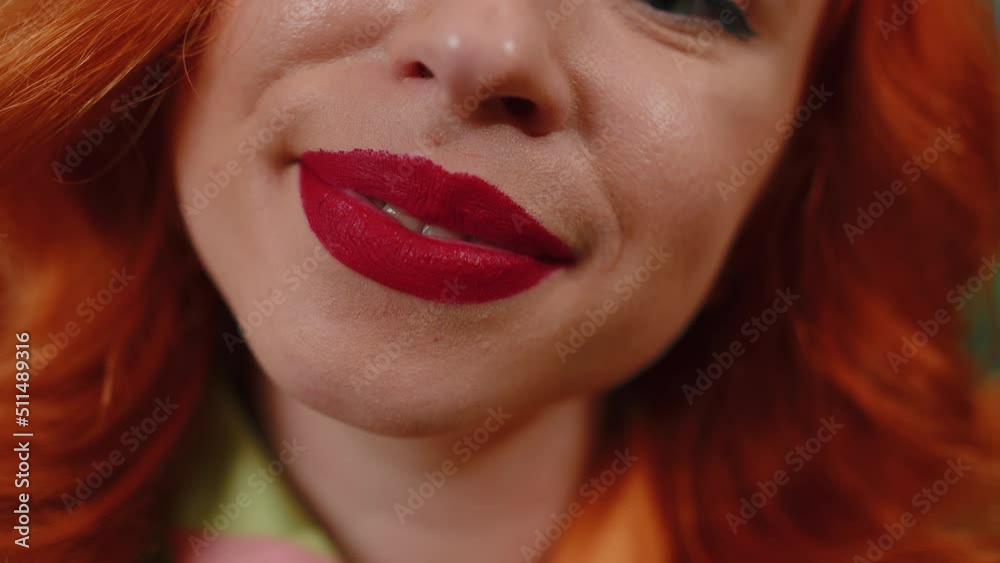 Portrait close-up of young happy redhead woman smile mouth, charming lovely ginger girl with perfect white great healthy teeth close up. Red lipstick. Female skincare model smiles wide for camera Portrait close-up of young happy redhead woman smile mouth, charming lovely ginger girl with perfect white great healthy teeth close up. Red lipstick. Female skincare model smiles wide for camera