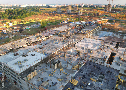 Construction cite with tower cranes on formwork. Building construction. Reinforced concreting. Civil Engineering on formworks. Construction and the built environment. Large construction project.