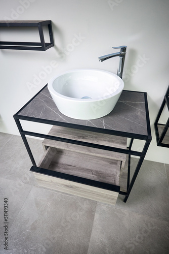 Fotobehang Stoneware countertop bathroom with tired beton wall stoneware tiled floor