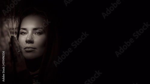 Portrait of a young woman in the shade close up