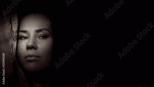 Portrait of a young woman in the shade close up