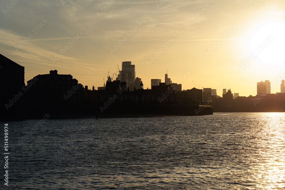 city skyline at sunset in London England near the river city skyline at sunset in London England near the river