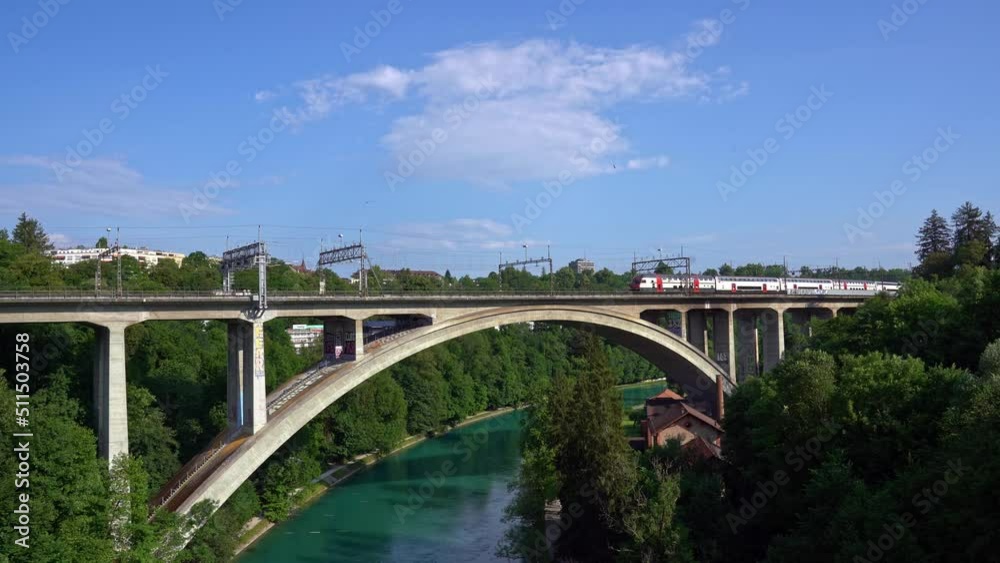 SBB train crossing Lorraine Railway Viaduct over Aare River at City of Bern on a sunny summer day. Movie shot June 16th, 2022, Bern, Switzerland. SBB train crossing Lorraine Railway Viaduct over Aare River at City of Bern on a sunny summer day. Movie shot June 16th, 2022, Bern, Switzerland.