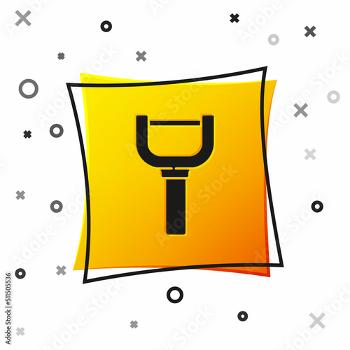 Black Peeler icon isolated on white background. Knife for cleaning of vegetables. Kitchen item, appliance. Yellow square button. Vector