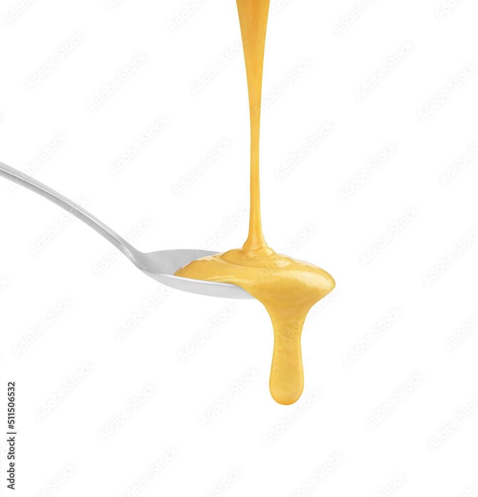 mustard in a spoon on a white background mustard in a spoon on a white background