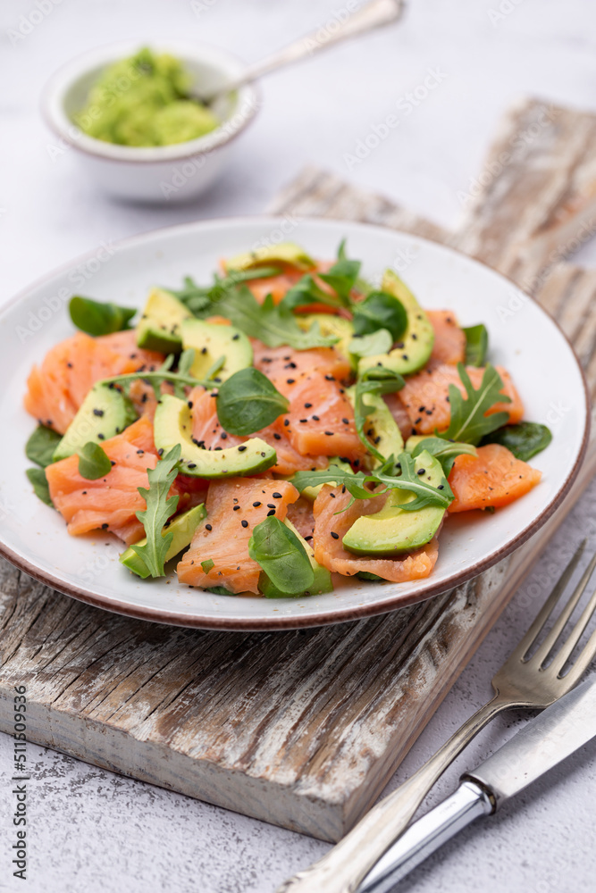 Salmon salad with avocado, for keto and low carb diet. Rusty background, top view, copy space. Salmon salad with avocado, for keto and low carb diet. Rusty background, top view, copy space.