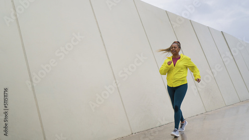Картината върху платно African senior woman running in the city