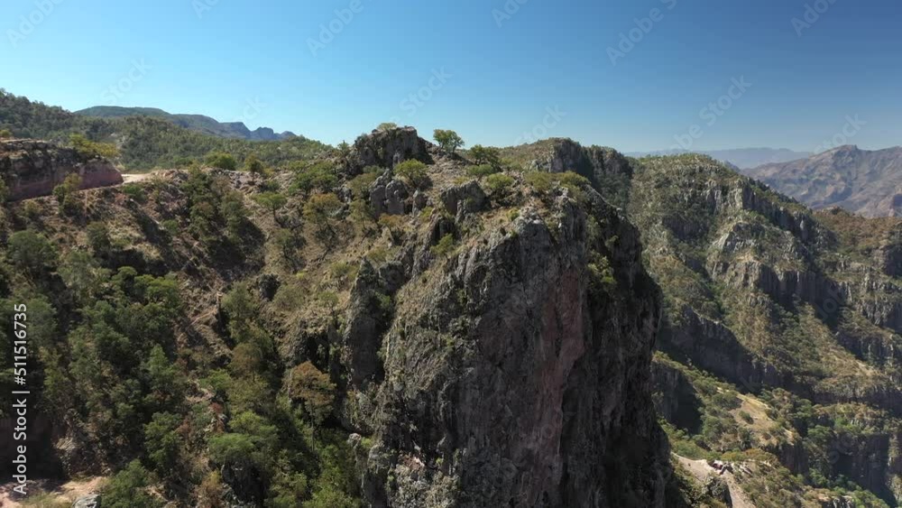 Steep cliffs of Copper Canyon in Mexico, rising forward aerial Steep cliffs of Copper Canyon in Mexico, rising forward aerial