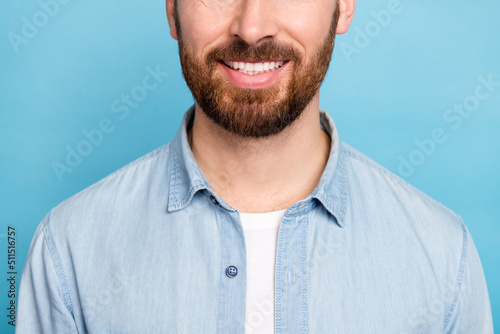 Cropped photo of guy smiling enjoy shiny teeth dentist clinic oral cavity therapy isolated blue color background photo