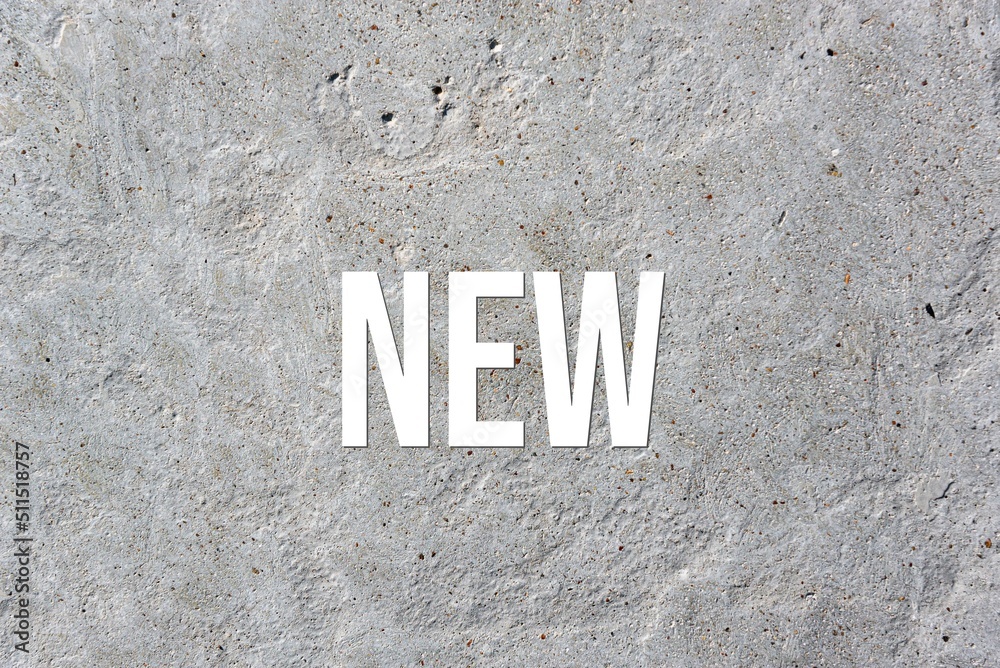 NEW - word on concrete background. Cement floor, wall. NEW - word on concrete background. Cement floor, wall.