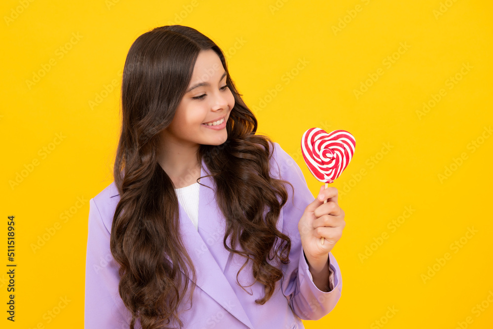 Teenage girl with lollipop, child eating sugar lollipops, kids sweets candy shop. Excited teenager girl. Happy teenager, positive and smiling emotions of teen girl.